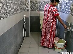 Non-professional Indian milf urinating
